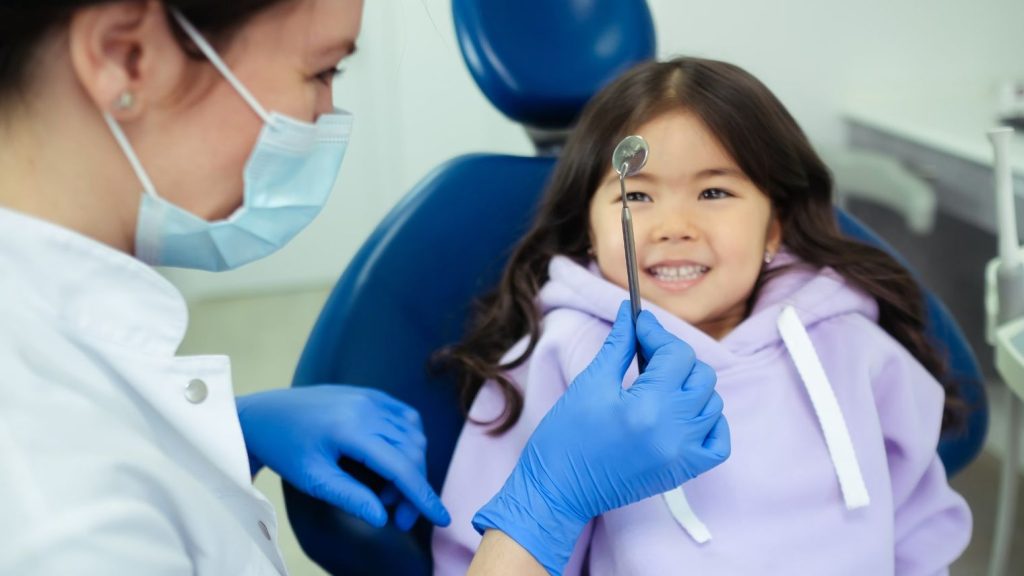 Dentist treating patient
