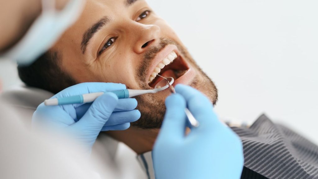 Dentist with young patient